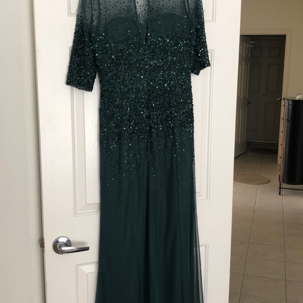 Stunning sequined green evening gown.